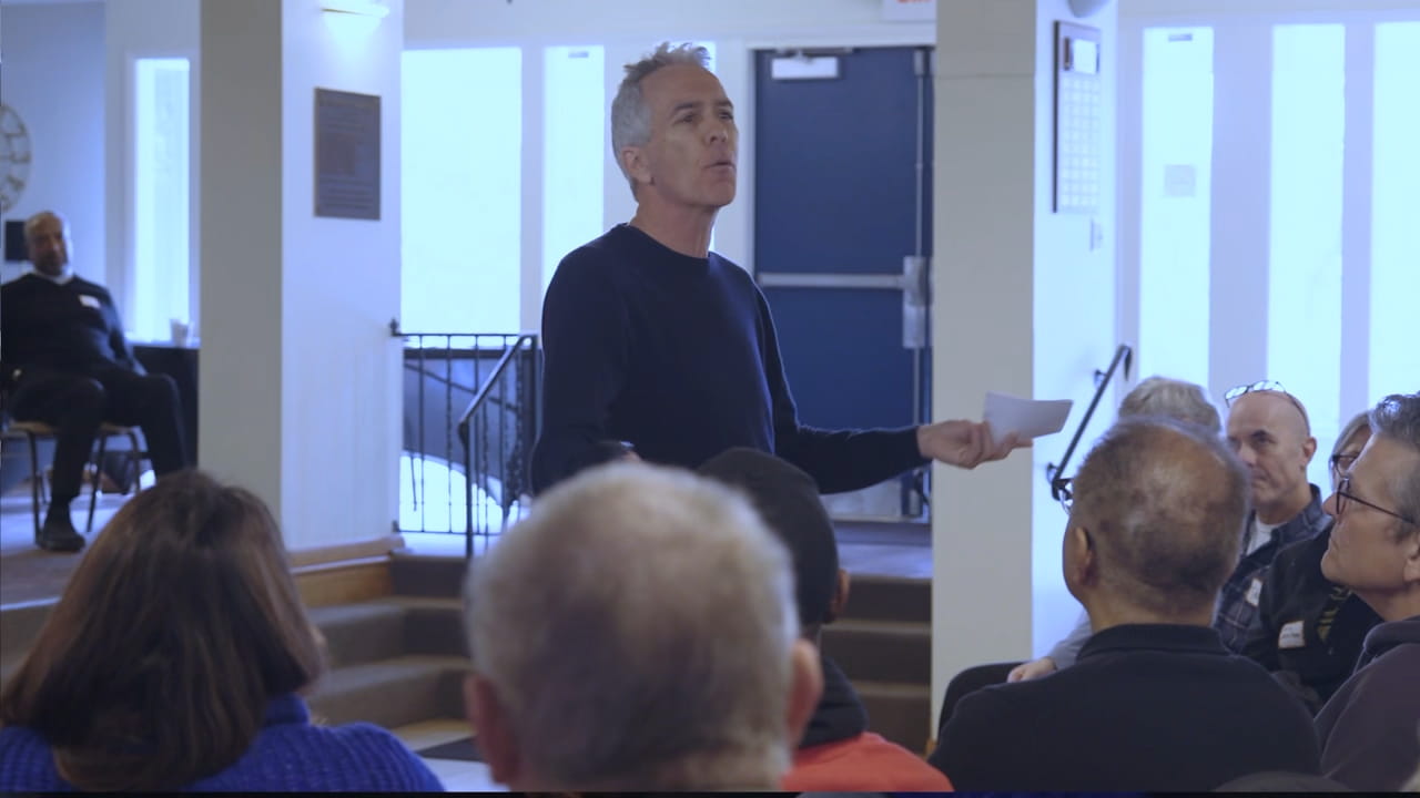 People gathered together in a welcoming community setting